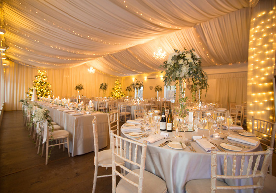 Fairy light decorated marquee with wedding meal set up at Aberdeen Wedding Venue Logie Country House